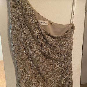 Long gown size 2 tan colored by Calvin Klein. Worn one time.
